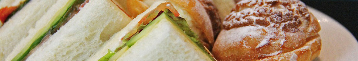 Eating Deli Sandwich at Capitol Dome Deli restaurant in Olympia, WA.